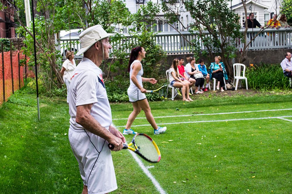 Bob Bedard and Bay Dabroski playing tennis on the Lawn Tennis Court at the Hillary House.